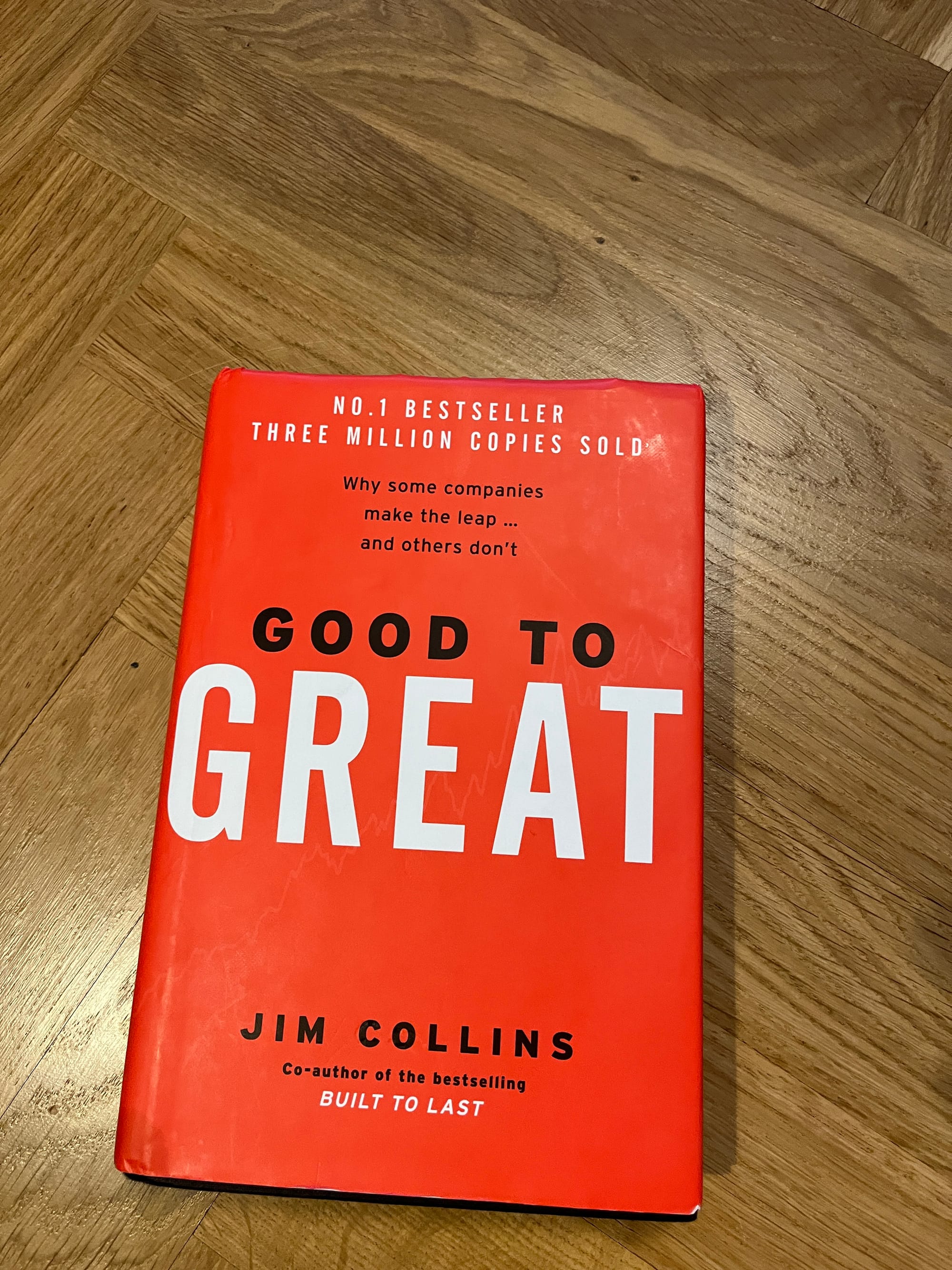 Photo of the book Good to Great on a wooden floor